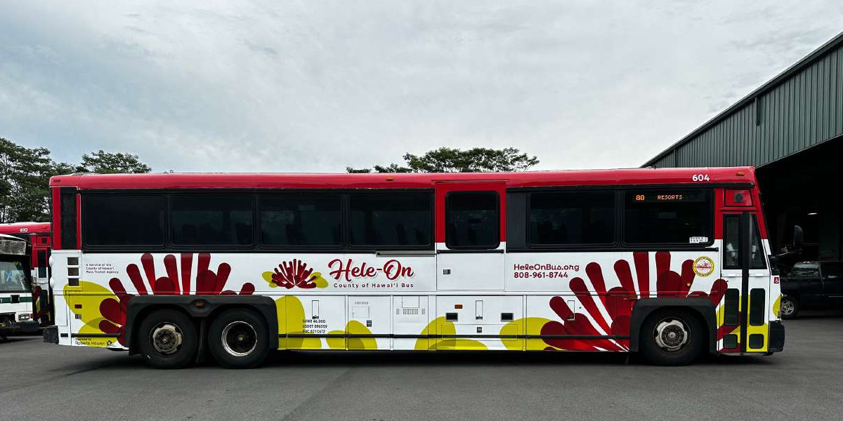 A red and white Hele-On bus operated by Hawaiʻi County
